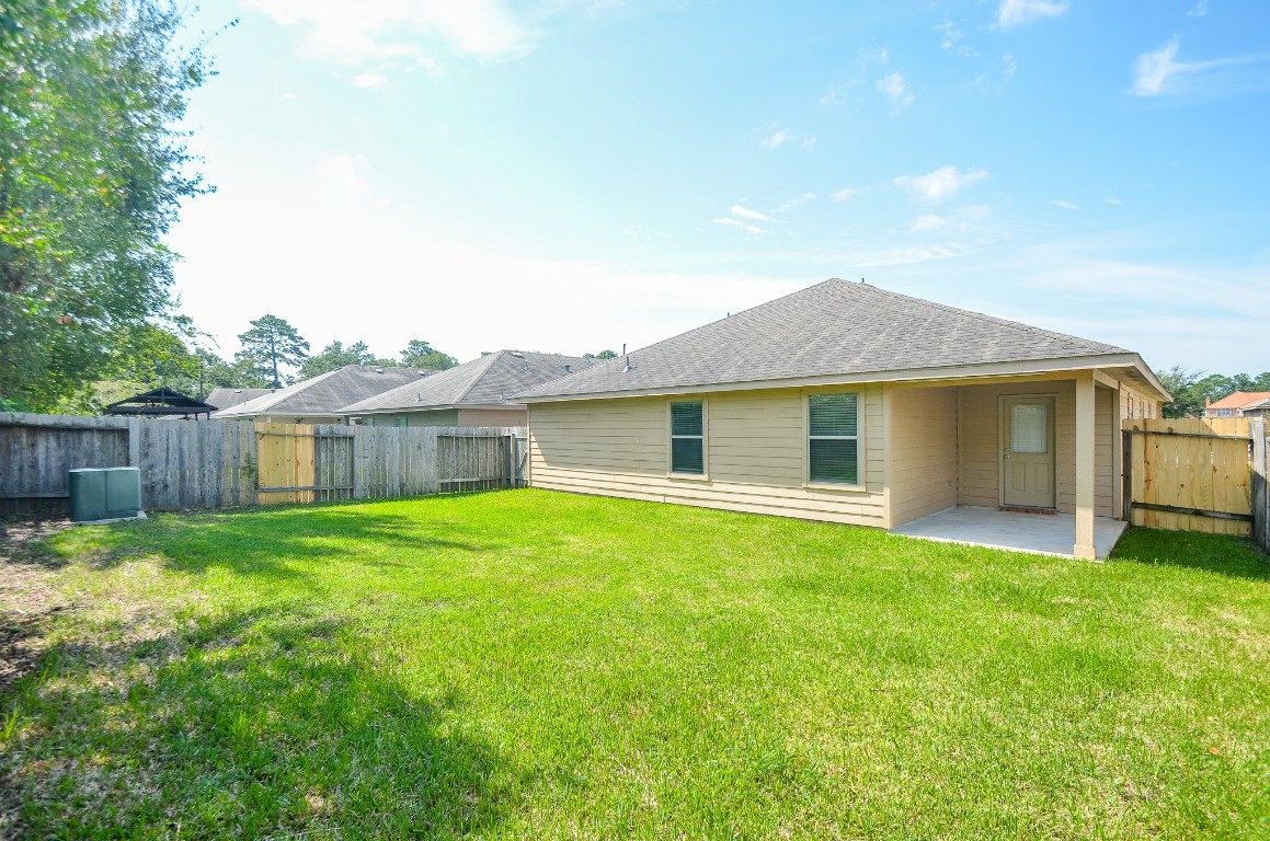 20114 Louetta Ash Drive Spring, TX 77388 - Photo 31 of 32 a front view of a house with yard and green space