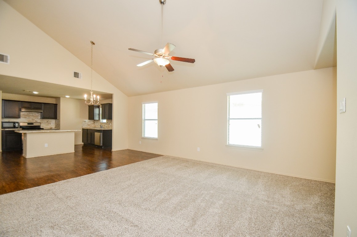 20114 Louetta Ash Drive Spring, TX 77388 - Photo 8 of 32 a view of an empty room with a window and kitchen view