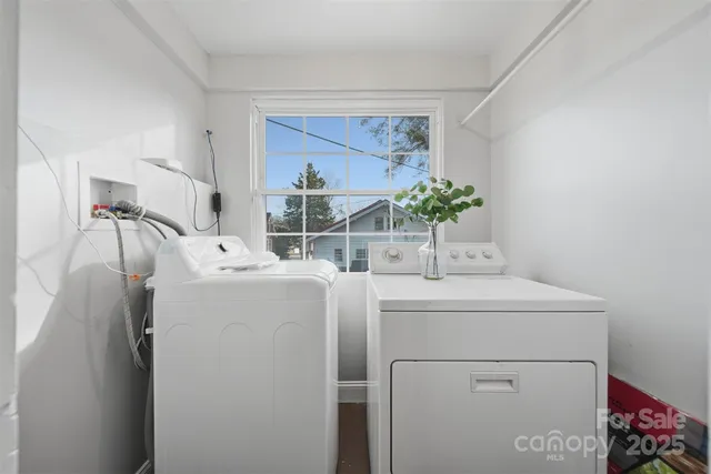 a room with a sink and a washer dryer