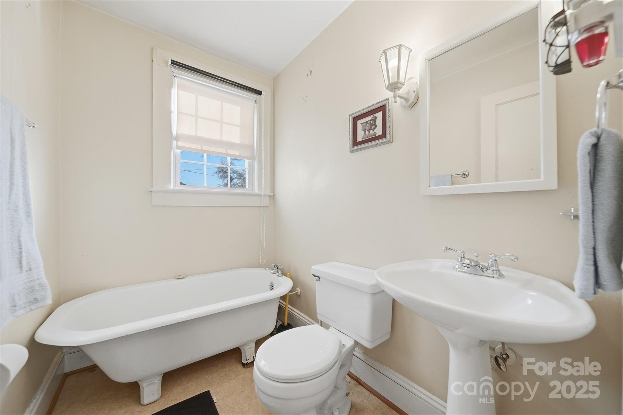 323 4th St Place Southwest Hickory, NC 28602 - Photo 16 of 32 a bathroom with a sink a toilet and a mirror