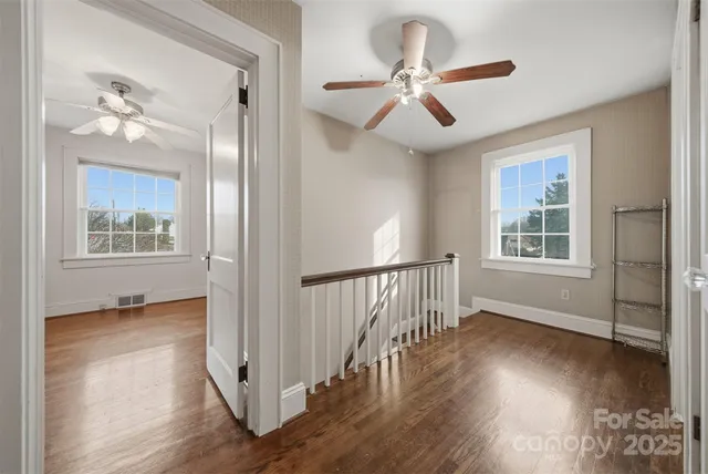 a view of an entryway with wooden floor