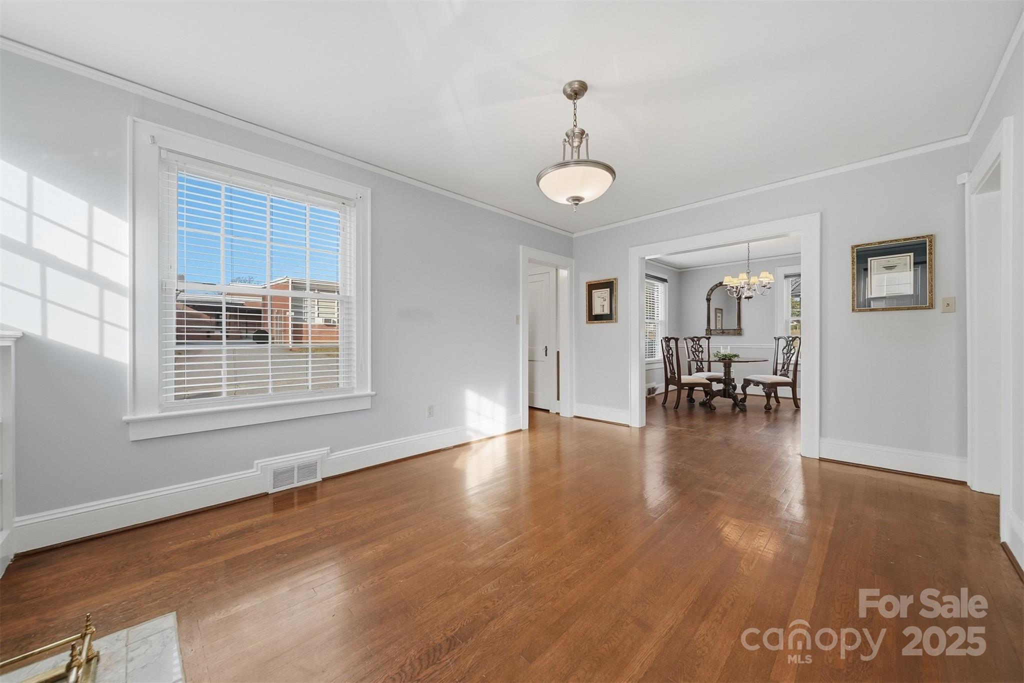 323 4th St Place Southwest Hickory, NC 28602 - Photo 5 of 32 a view of empty room with wooden floor and windows