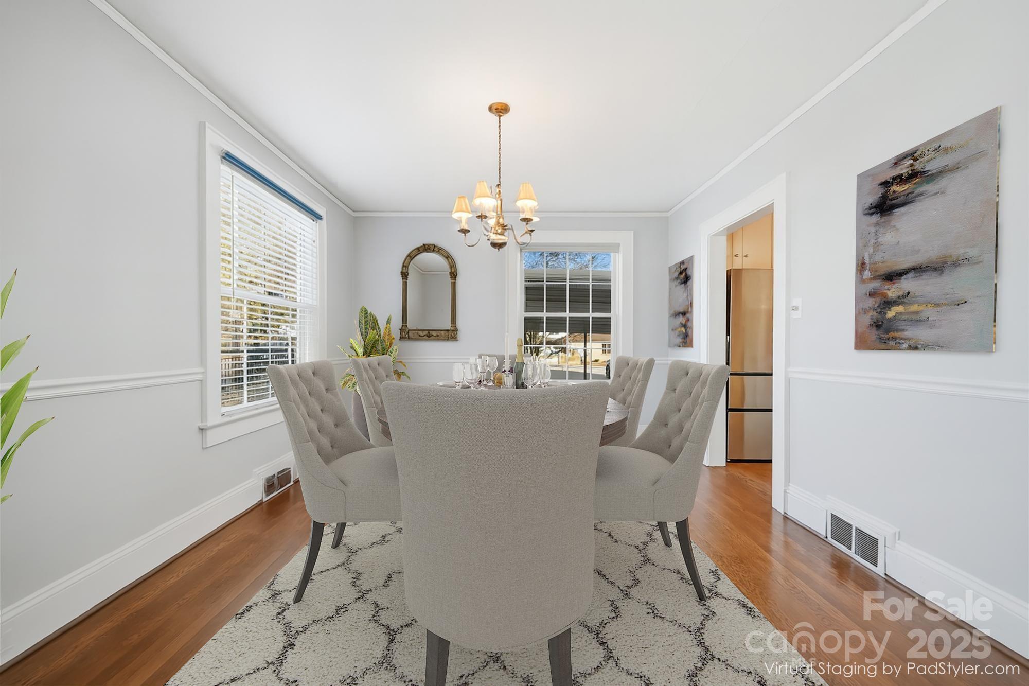 323 4th St Place Southwest Hickory, NC 28602 - Photo 9 of 32 a dining room with furniture a chandelier and wooden floor