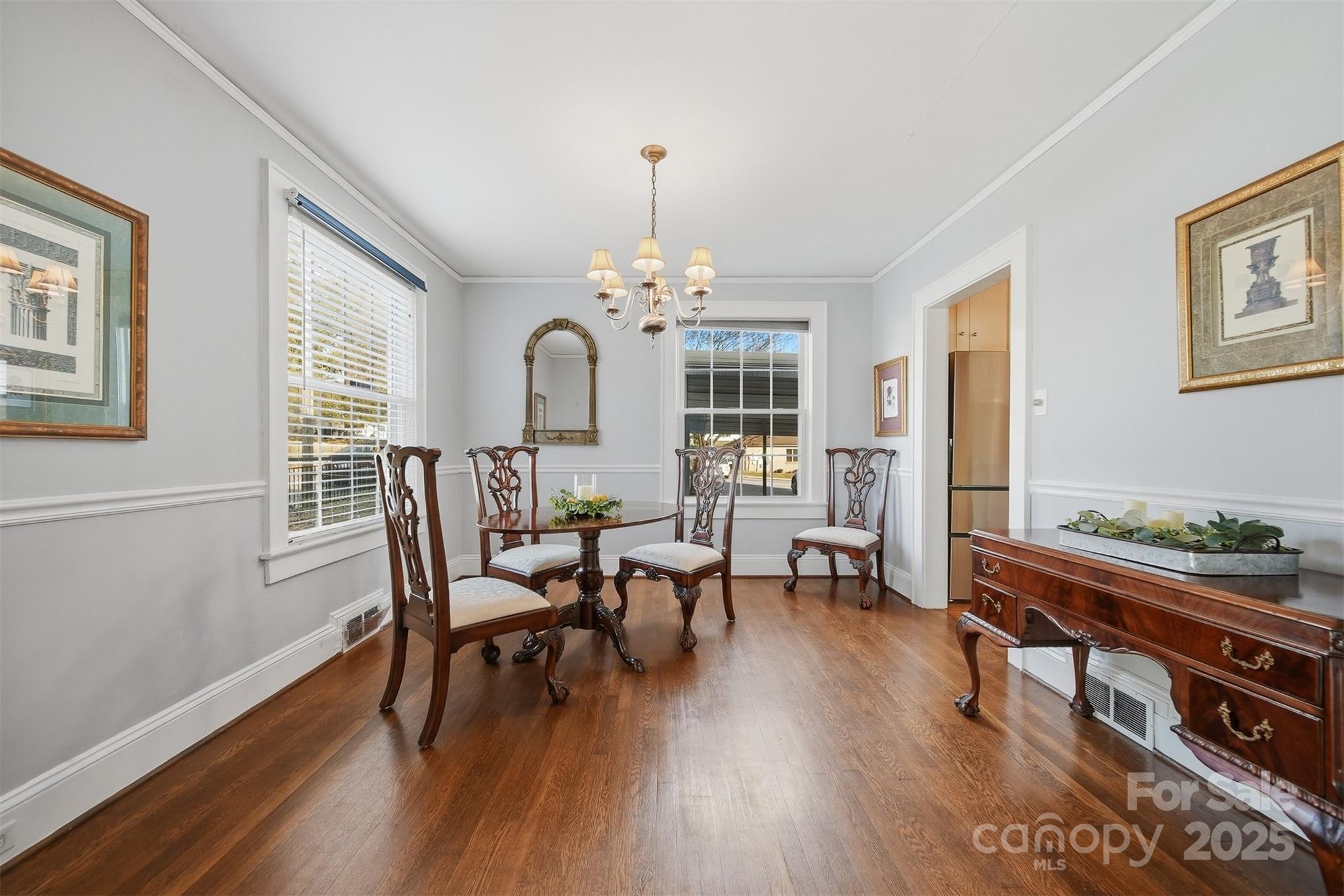 323 4th St Place Southwest Hickory, NC 28602 - Photo 10 of 32 a view of a dining room with furniture and wooden floor