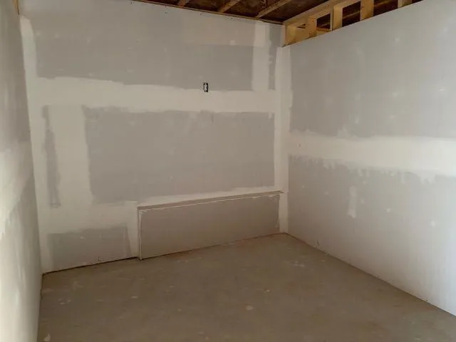 a view of staircase with white walls