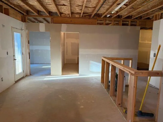 a view of a livingroom with furniture and a window
