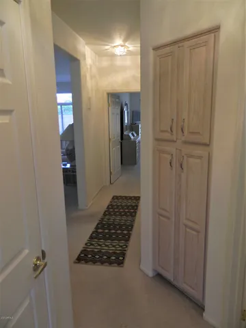 a bathroom with a granite countertop sink a toilet a mirror and shower