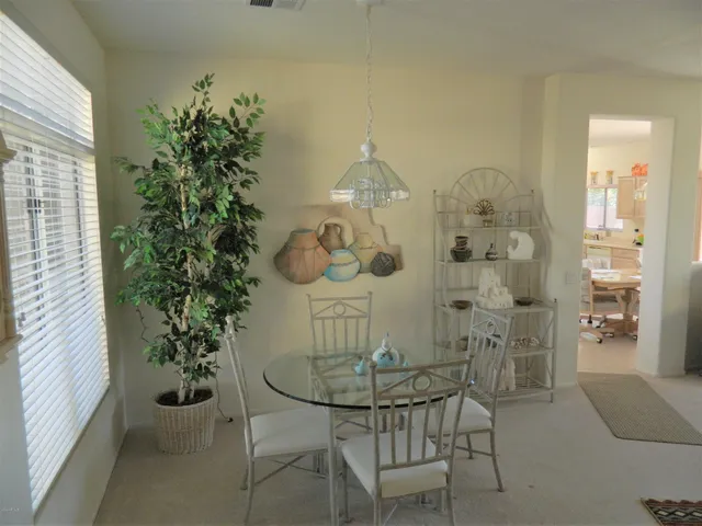 a view of a dining room with furniture