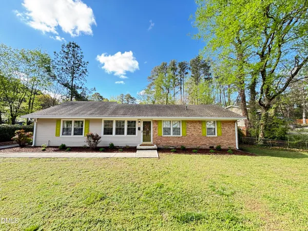 a view of an entryway with wooden floor and garden
