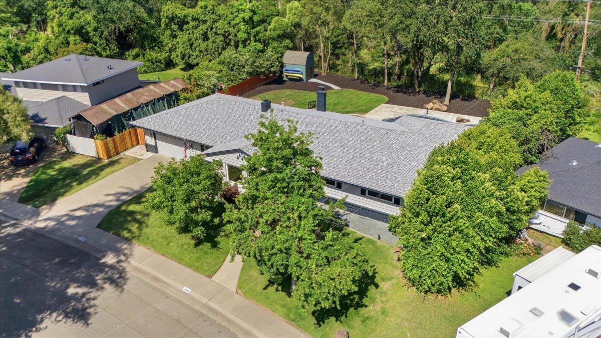 4849 Alexon Way Carmichael, CA 95608 - Photo 45 of 50 an aerial view of a house with a yard and greenery