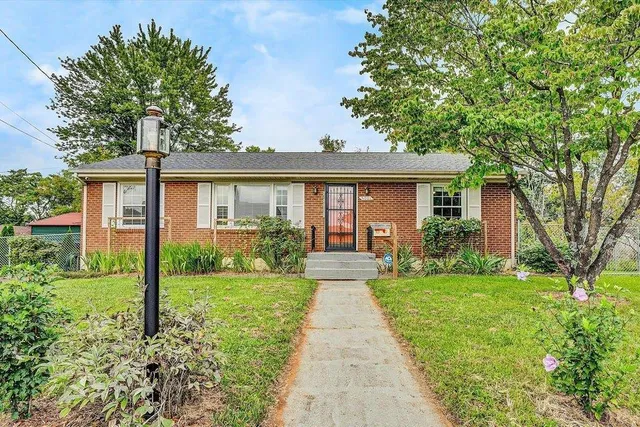 a front view of a house with yard