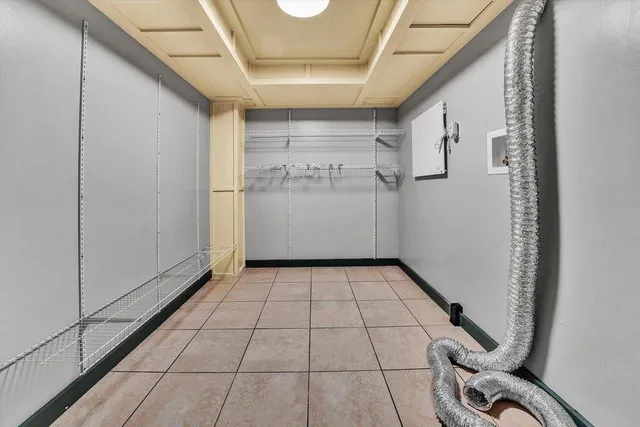 a kitchen with a stove sink and cabinets