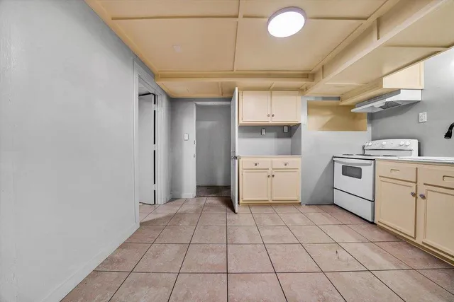 a view of a room with wooden floor and white walls