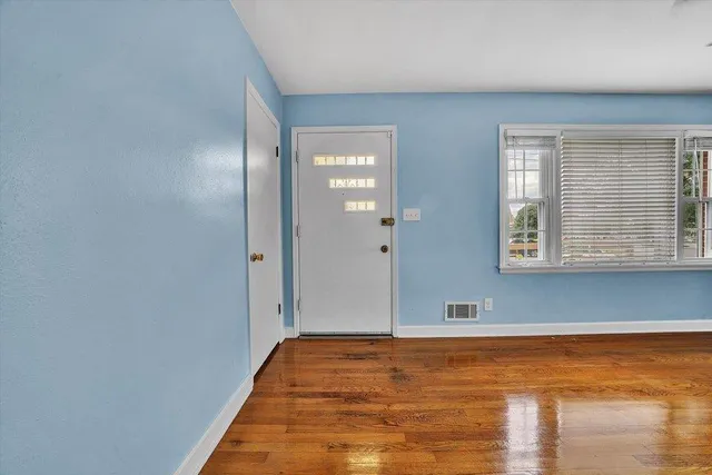 a view of an empty room and window