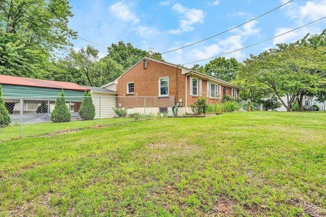 a bedroom with a bed and a potted plant