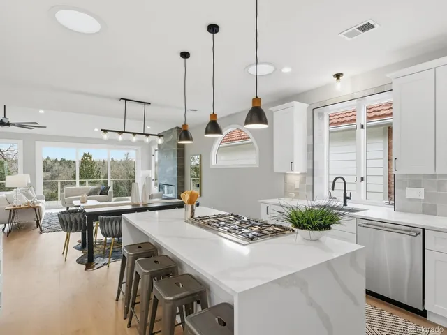 a kitchen with a table chairs stove and cabinets
