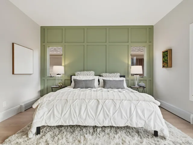 a large white bed in a white room