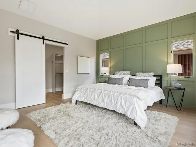 a spacious bedroom with a bed and furniture