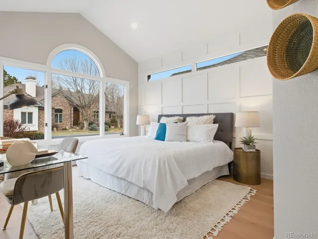 a spacious bedroom with a bed and window