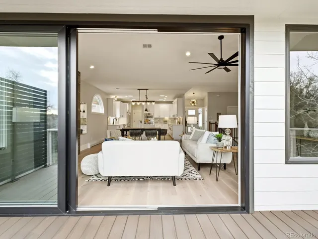 a view of living room and kitchen with furniture and a window