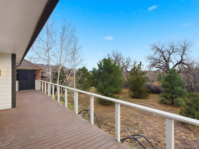 a view of balcony and yard