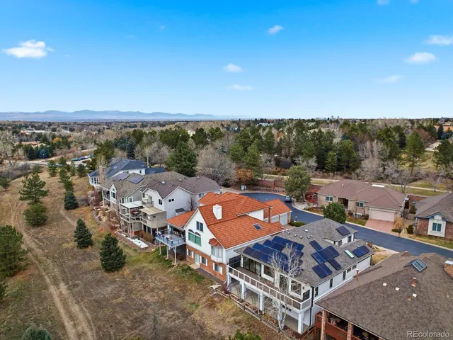an aerial view of a house with a garden