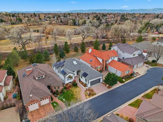an aerial view of residential houses with outdoor space