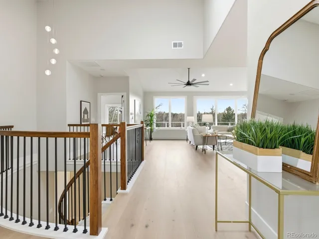 a view of a living room and a balcony