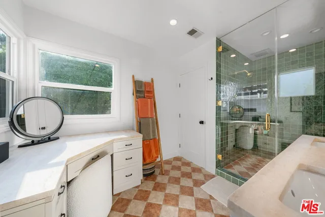 a white bath tub sitting next to a white toilet