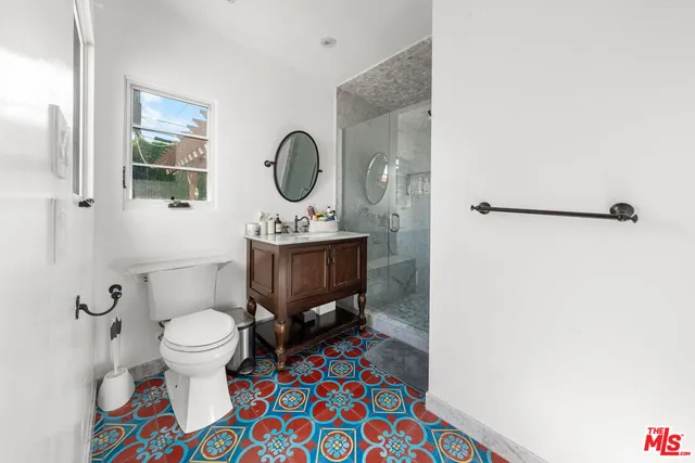 a view of a house with a wooden fence