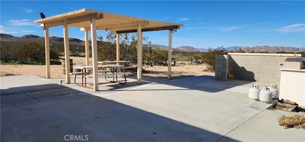 6042 Milne Road Landers, CA 92285 - Photo 10 of 22 Patio cover and concrete with BBQ area
