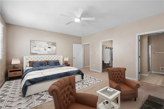 a bedroom with a bed and a couch