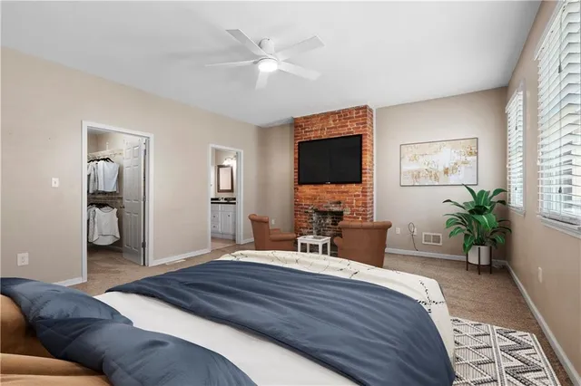 a bedroom with a large bed and a flat screen tv