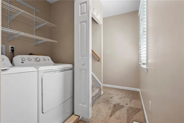 a utility room with dryer and washer