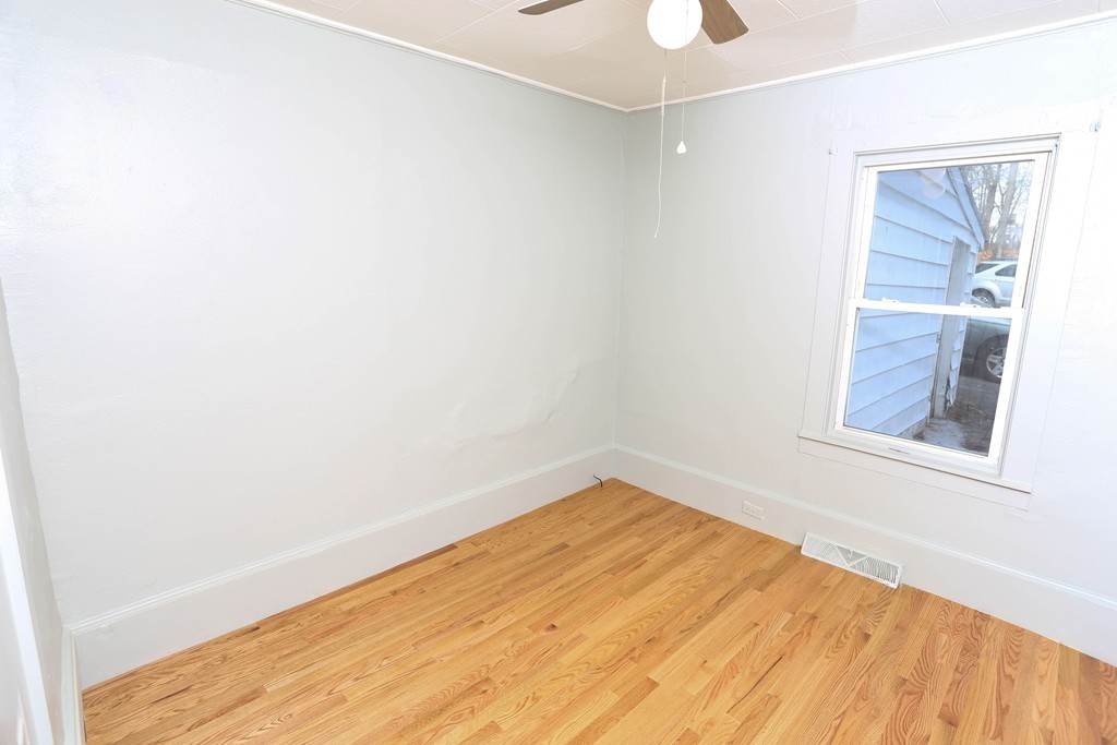 22 Vigeant Street Ware, MA 01082 - Photo 15 of 16 a view of empty room with wooden floor and fan