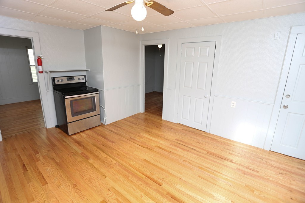 22 Vigeant Street Ware, MA 01082 - Photo 7 of 16 a bedroom with a bed and a view of kitchen