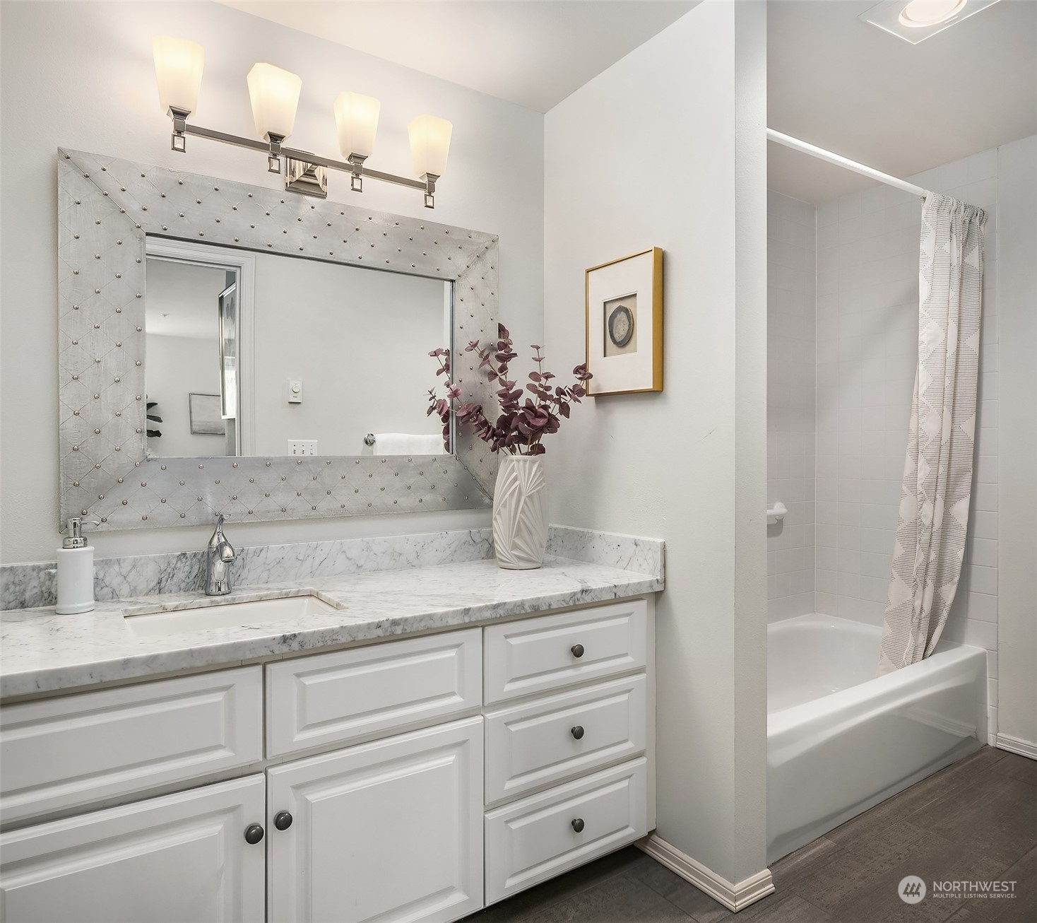 7207 210th Street Southwest, Unit 201 Edmonds, WA 98026 - Photo 15 of 19 a bathroom with a granite countertop sink mirror and bathtub