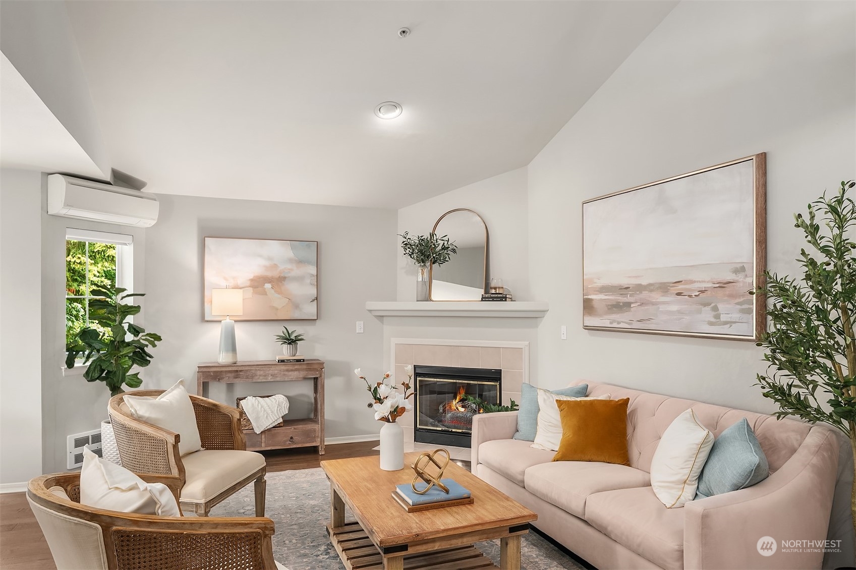 7207 210th Street Southwest, Unit 201 Edmonds, WA 98026 - Photo 5 of 19 a living room with furniture a fireplace and a potted plant