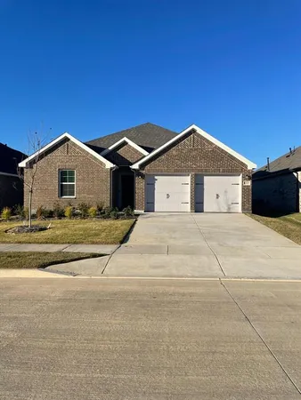 a view of house with yard and front view of house