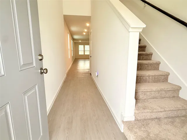a view of a hallway with staircase