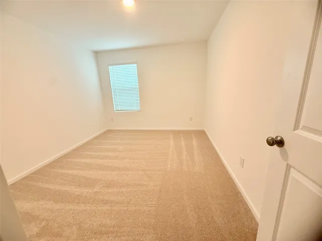 a view of a room that has a window in it