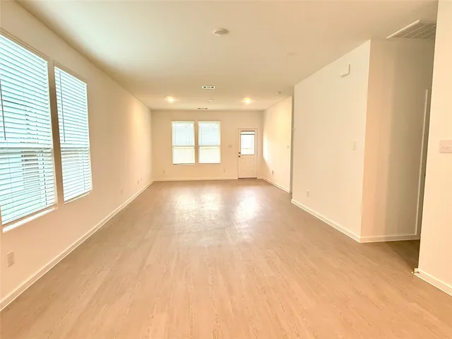 a view of an empty room and window