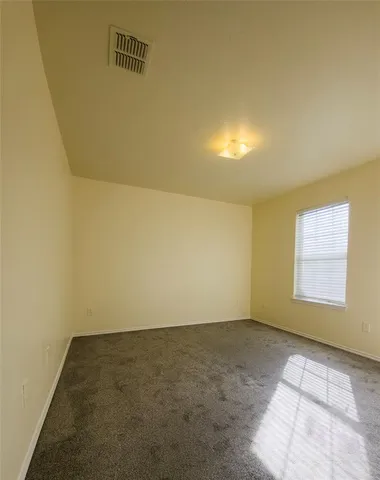 an empty room with a empty space and a window