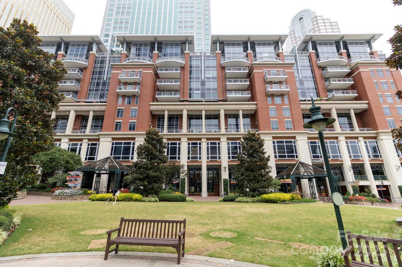 a front view of a building with a garden