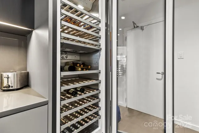 a living room with furniture potted plant and a fireplace
