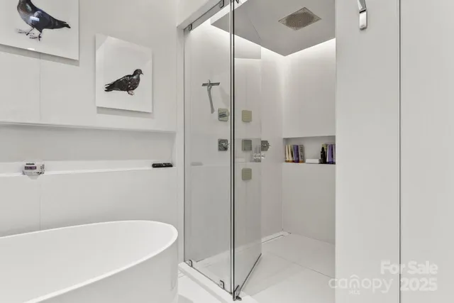 a view of a room with wooden floor and furniture