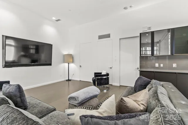 a kitchen with stainless steel appliances granite countertop a refrigerator and a stove