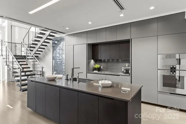 a kitchen with a sink and refrigerator