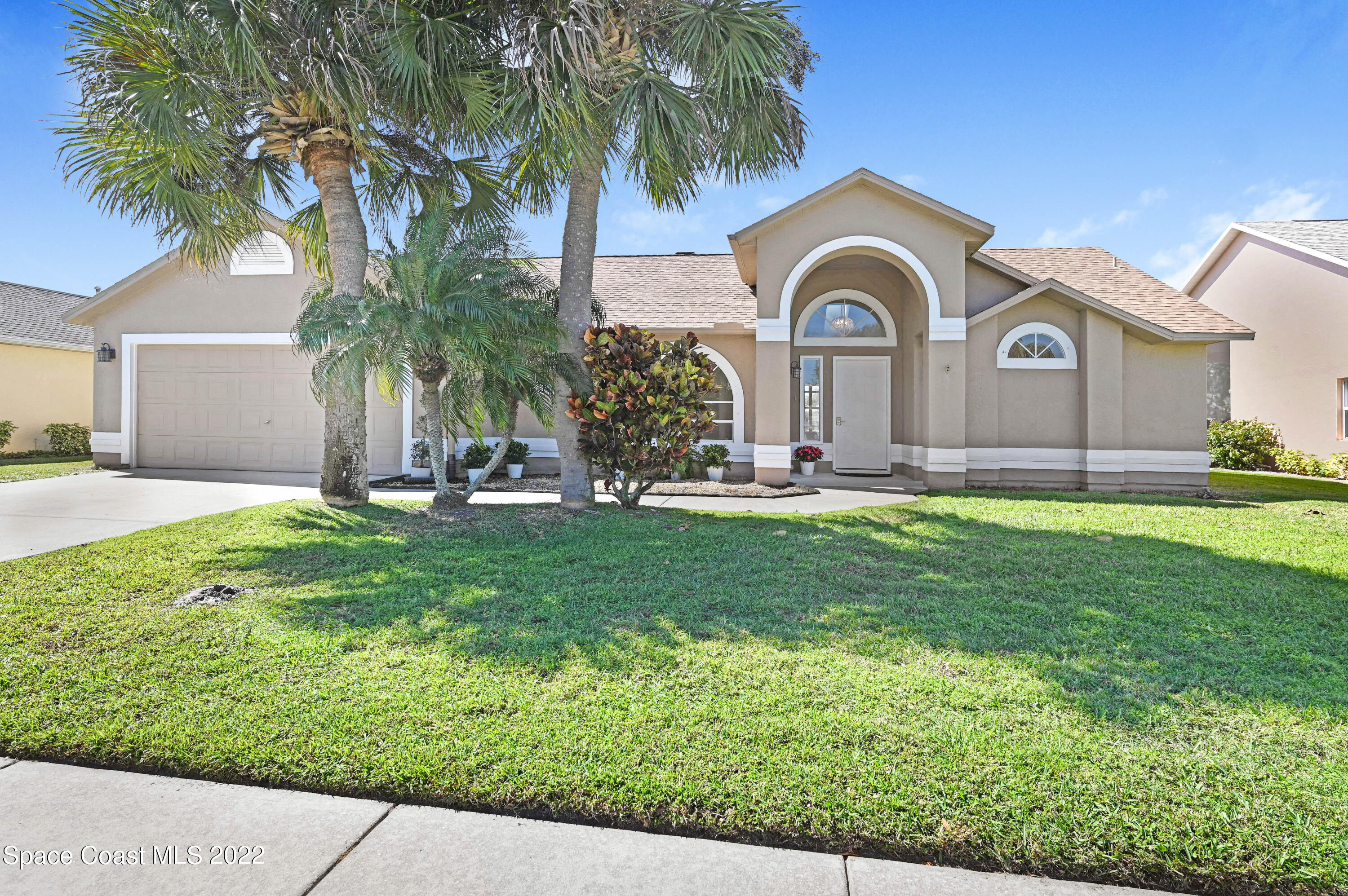 930 Turtle Pond Way Melbourne, FL 32940 - Photo 1 of 56 a front view of a house with garden