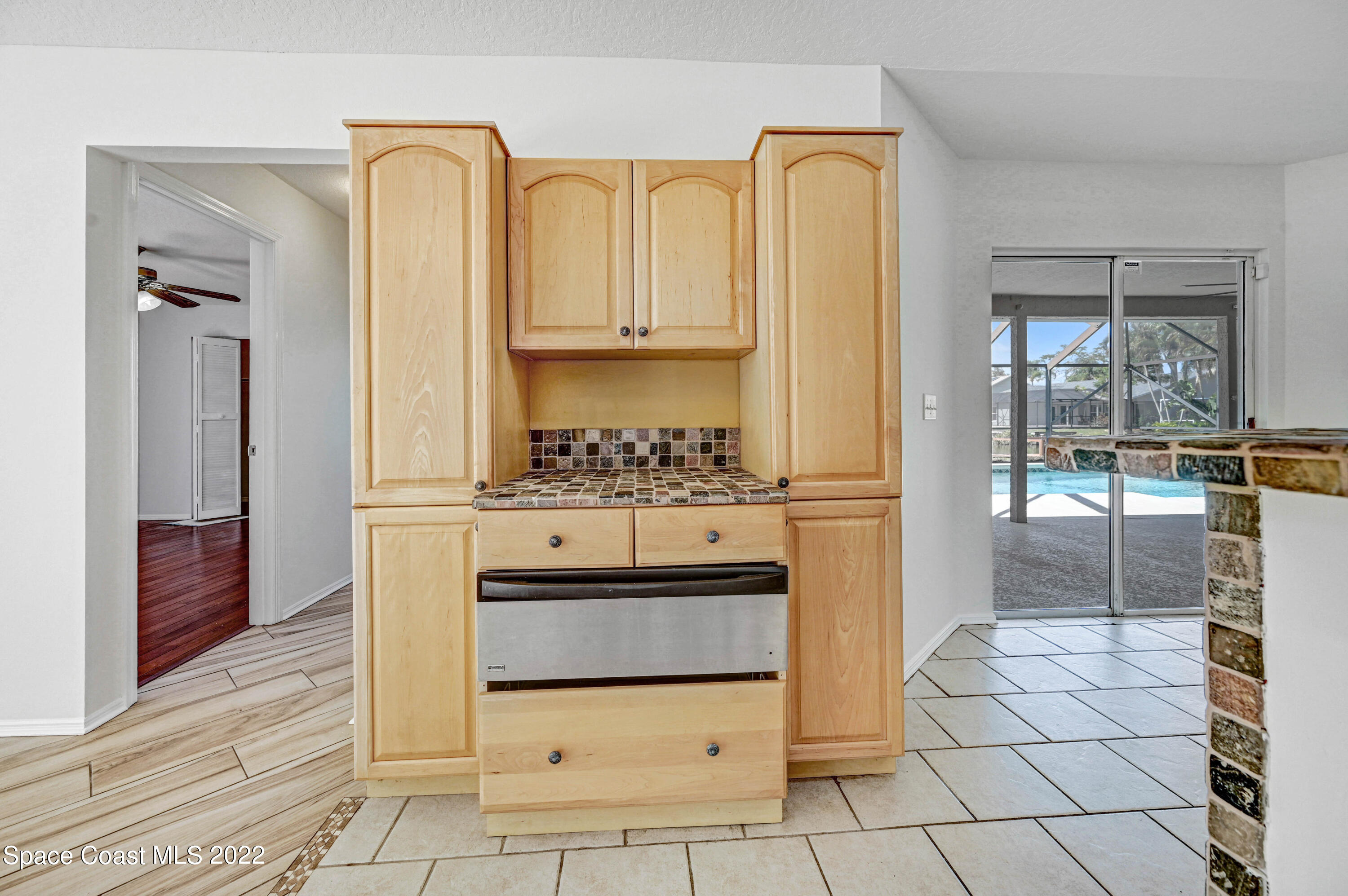930 Turtle Pond Way Melbourne, FL 32940 - Photo 17 of 56 a bathroom with a granite countertop sink a mirror and a shower